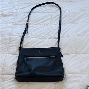 Kate Spade Black Crossbody Bag with gold trim.